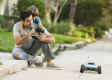 PowerfulProduct_450x325 lifestyle image of father and son playing with a RC car